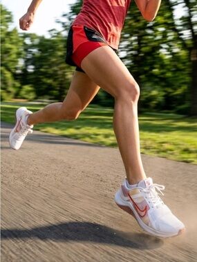 NIKE Size 6 White Running Sneakers with Orange Swoosh